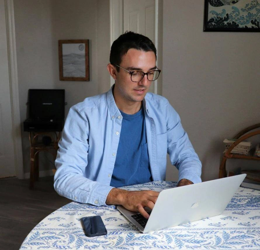 Professional working on a laptop at home office